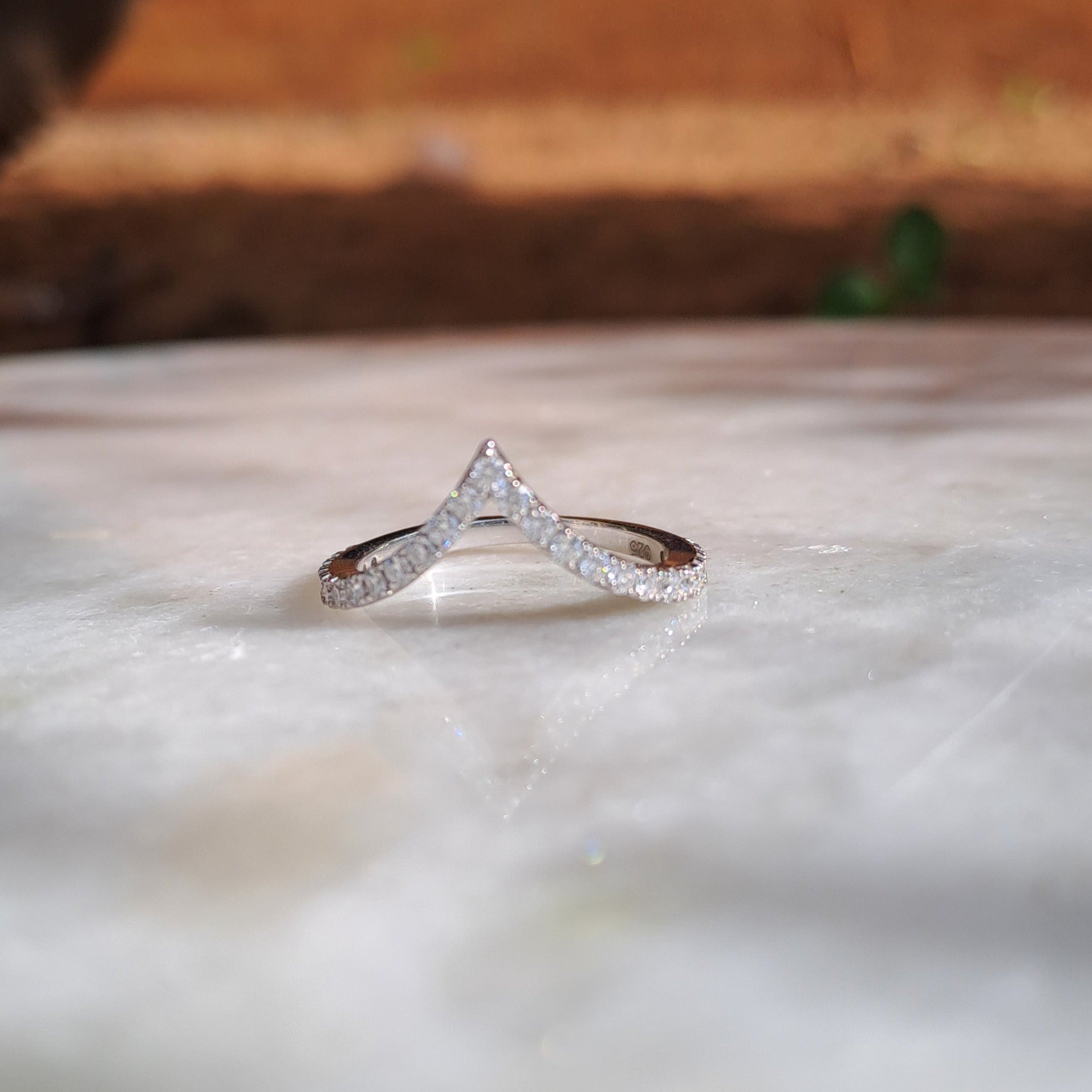 Regal Studded Vanki Pattern 18KT Diamond Ring